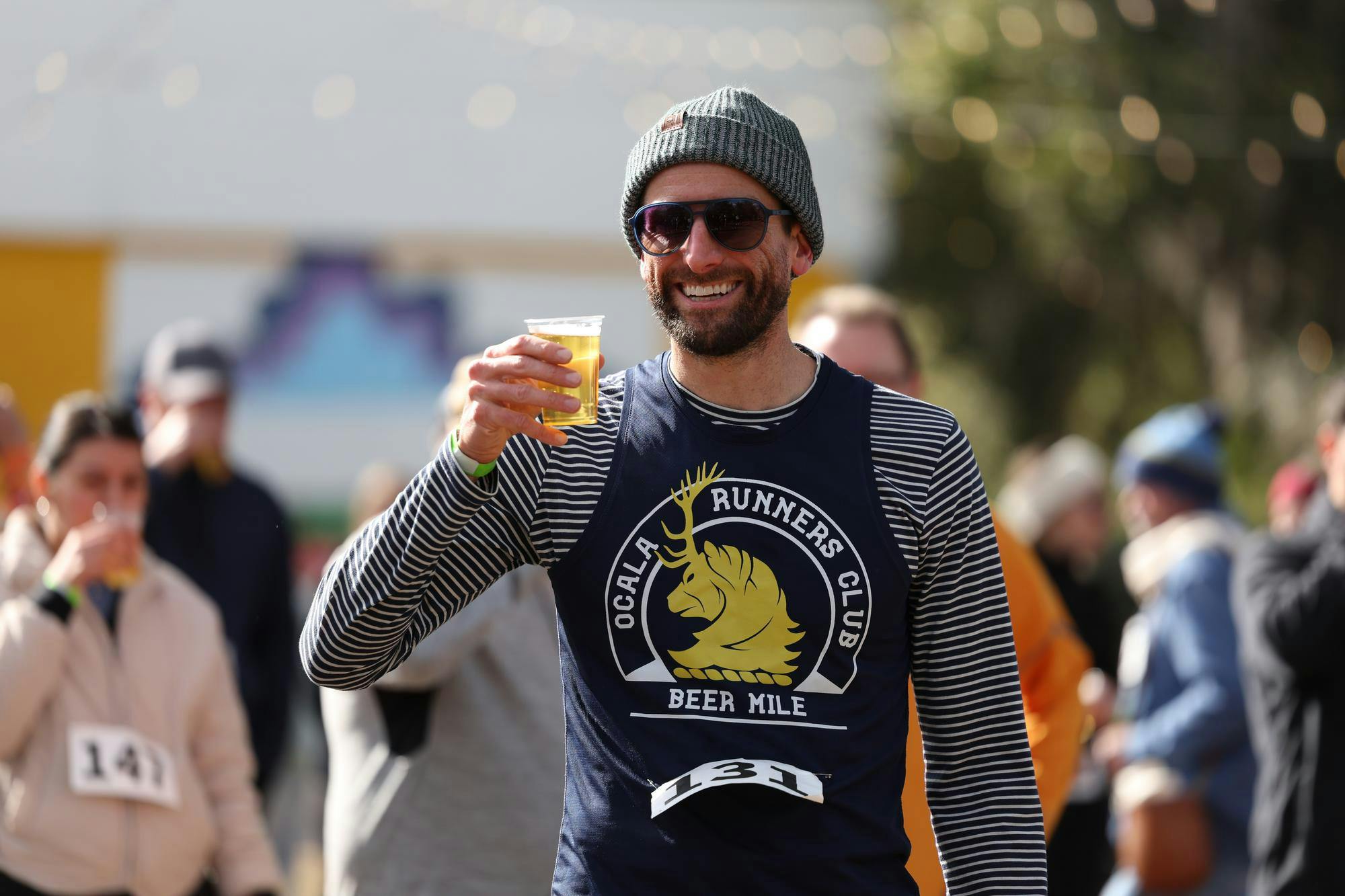 Gainesville Beer Mile winner Adam Truesdale smiles before drinking his final beer of the race on Saturday, Jan. 31, 2026.