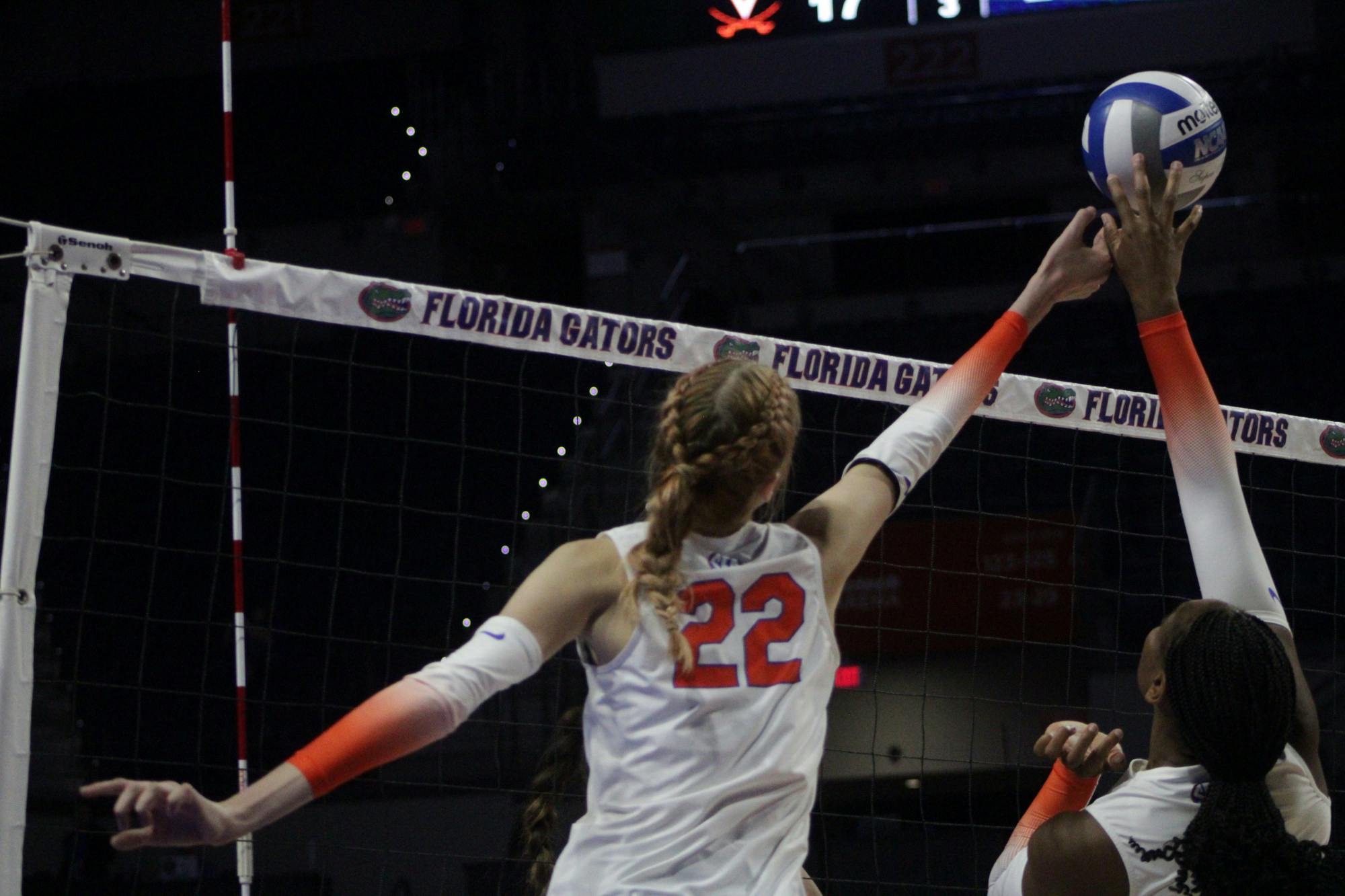 Senior outside hitter Marina Markova and sophomore middle blocker Gabrielle Essix combine for a block against Virginia Aug. 27, 2022. 