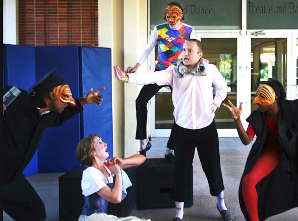 <p>Second-year graduate students Katie Pankow, 24, and Joshua Hamilton, 26, perform an improv show Monday on the Reitz Union Colonnade.</p>