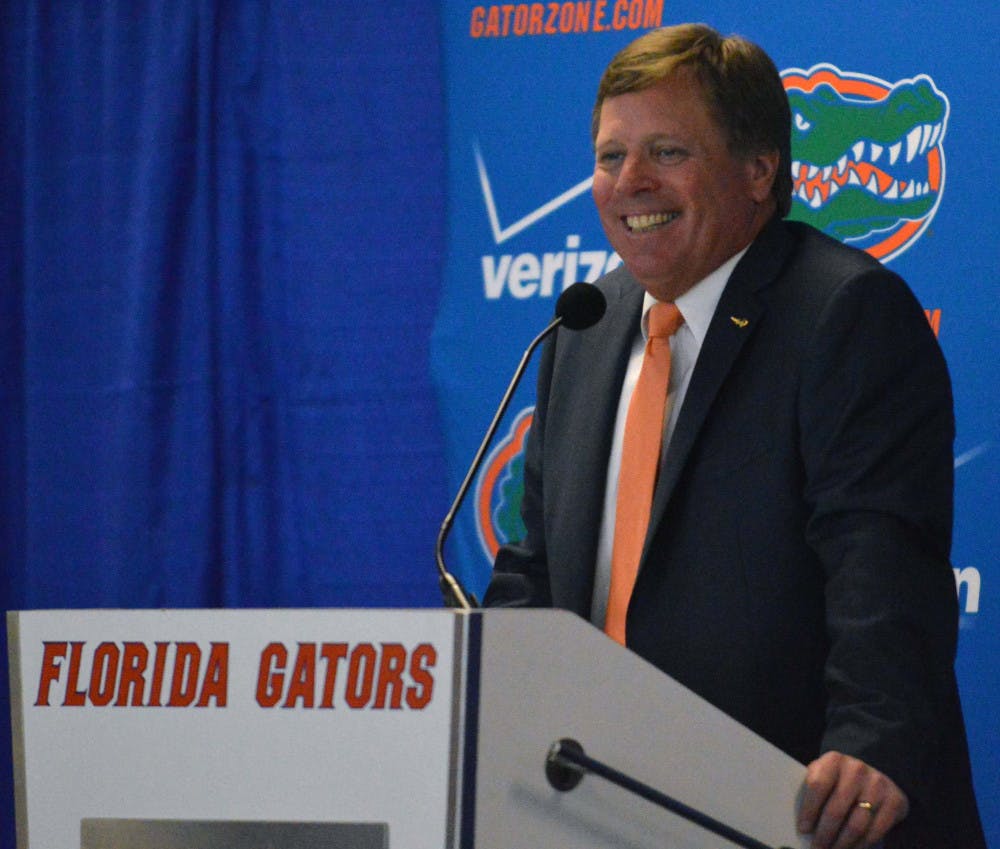 <p>New head football coach Jim McElwain following his introductory press conference on Saturday at Ben Hill Griffin Stadium.</p>