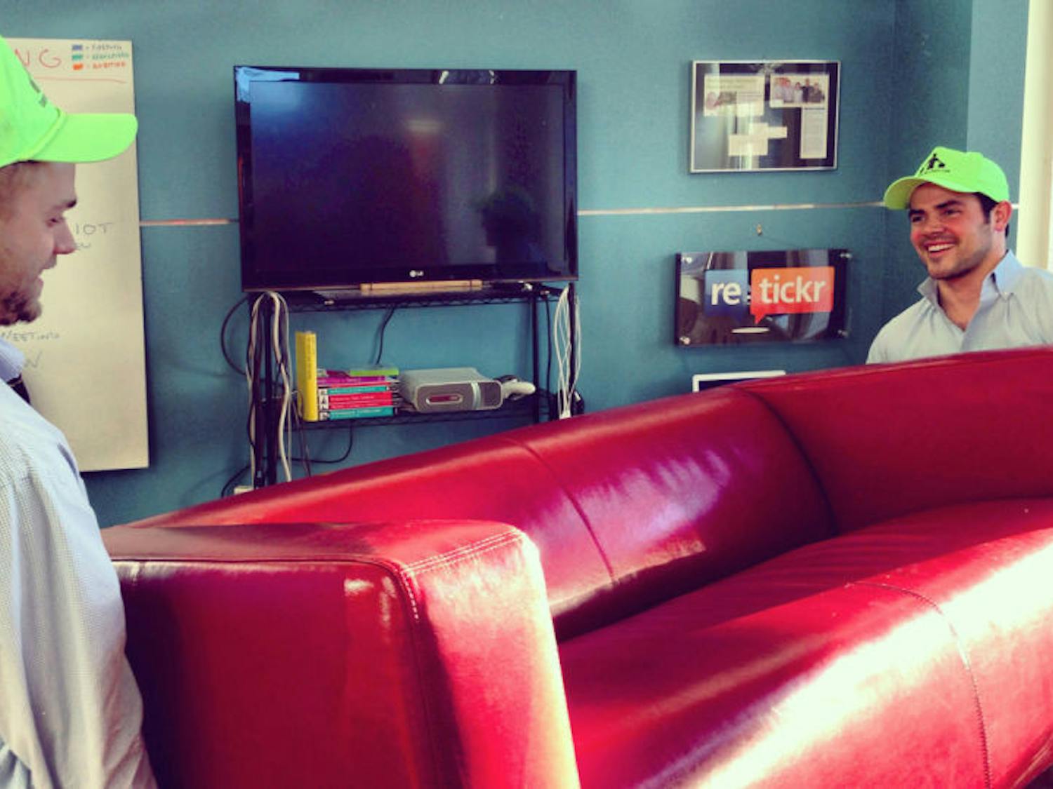 Bellhops student movers Weston Wamp, right, and Jared Houghton carry a couch as part of their moving service in Chattanooga, Tenn. Bellhops is run completely via a web application.
