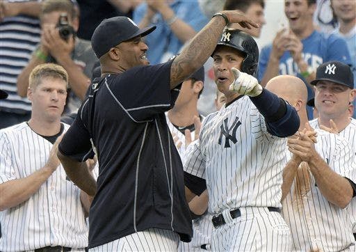New York Yankees' Alex Rodriguez, center right, celebrates with CC Sabathia after Rodriguez hit a home run — his 3,000th career hit — during the first inning of a baseball game against the Detroit Tigers on June 19 at Yankee Stadium in New York.