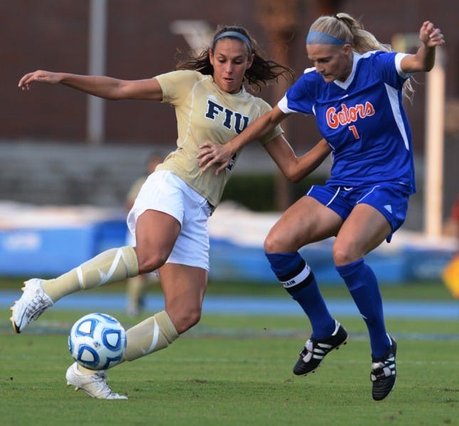 Florida Forward Kathryn(7) Williamson battles for the ball against FIU forward Chelsea Leiva (2) in a 3-0 win on Sept 2.