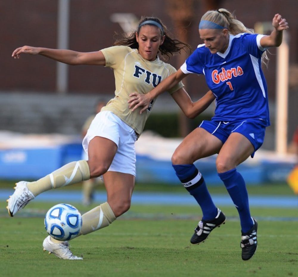 <p>Florida Forward Kathryn(7) Williamson battles for the ball against FIU forward Chelsea Leiva (2) in a 3-0 win on Sept 2.</p>