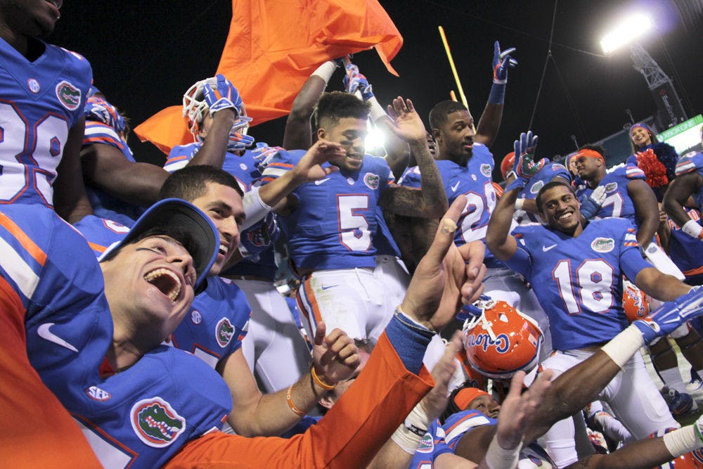 <p>UF players celebrate following Florida's 38-20 win against Georgia on Saturday at EverBank Field in Jacksonville.</p>