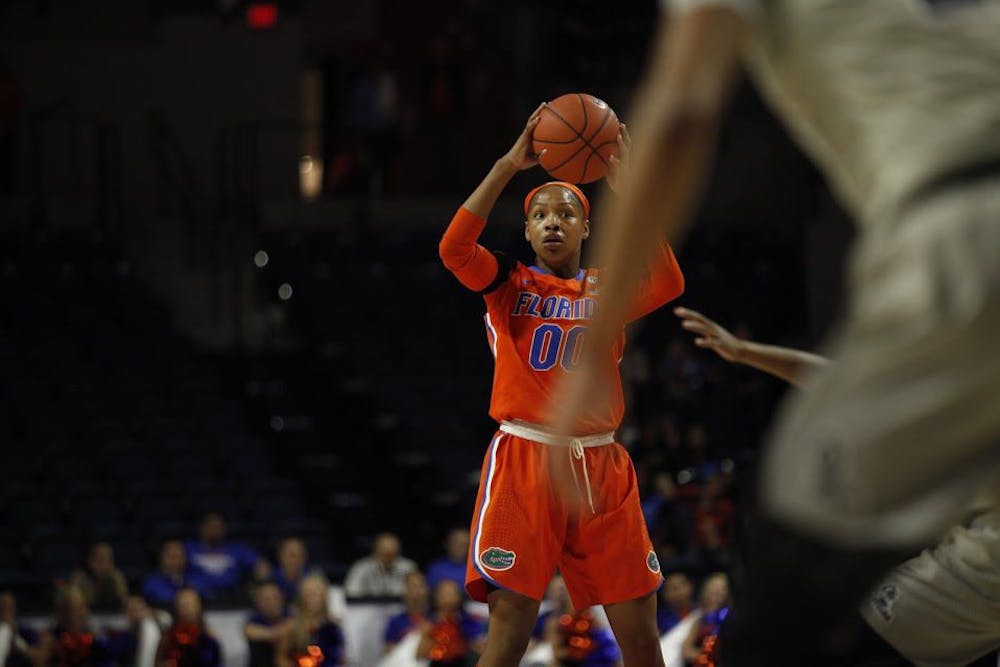 <p>UF guard Delicia Washington looks to pass during Florida's 84-75 loss to Ole Miss on Feb. 6, 2017, in the O'Connell Center.</p>