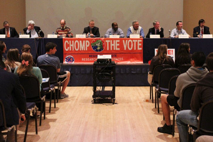 Mayor and City Commission candidates speak to students at the Chomp the Vote forum Wednesday evening at the Reitz Union.