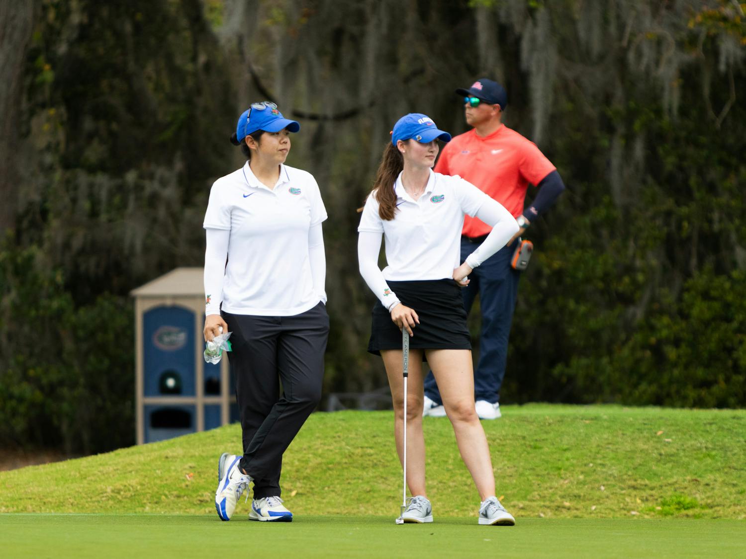 Gators women's senior golfer Maisie Filler and assistant coach Beth Wu look on at the Gators Invitational on Friday, March 1, 2024. 