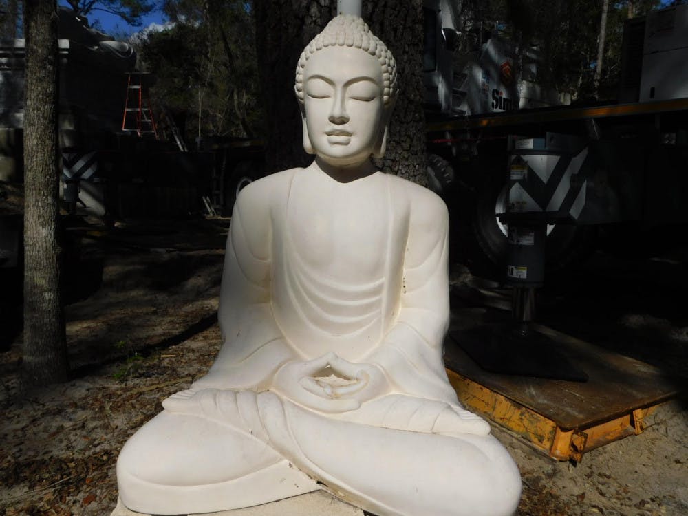 <p><span>The smaller sitting Buddha weighs 66,138.7 pounds. </span></p>