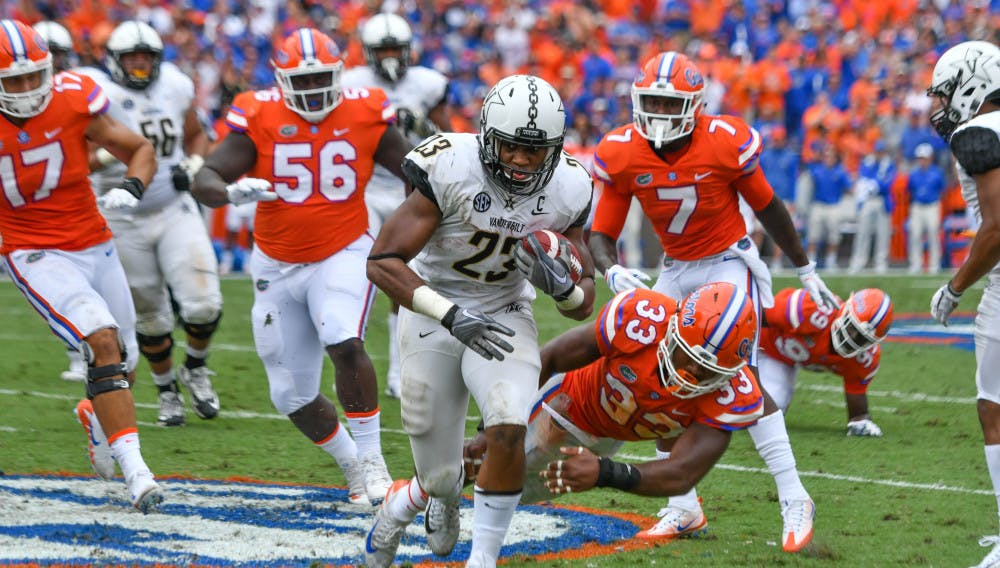 Linebacker David Reese (33) and the Gators defense will have their hands full dealing with Vanderbilt running backs Khari Blasingame (23) and Ke'Shawn Vaughn this Saturday.