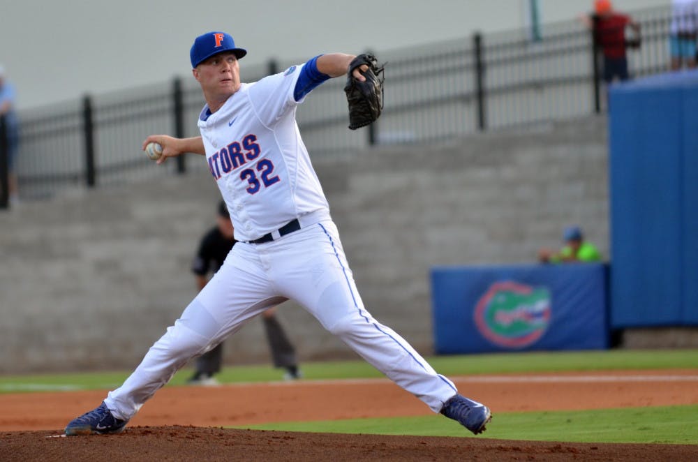 UF's Logan Shore pitches during Florida's 14-3 win against the South Carolina Gamecocks on April 10, 2015 at McKethan Stadium.