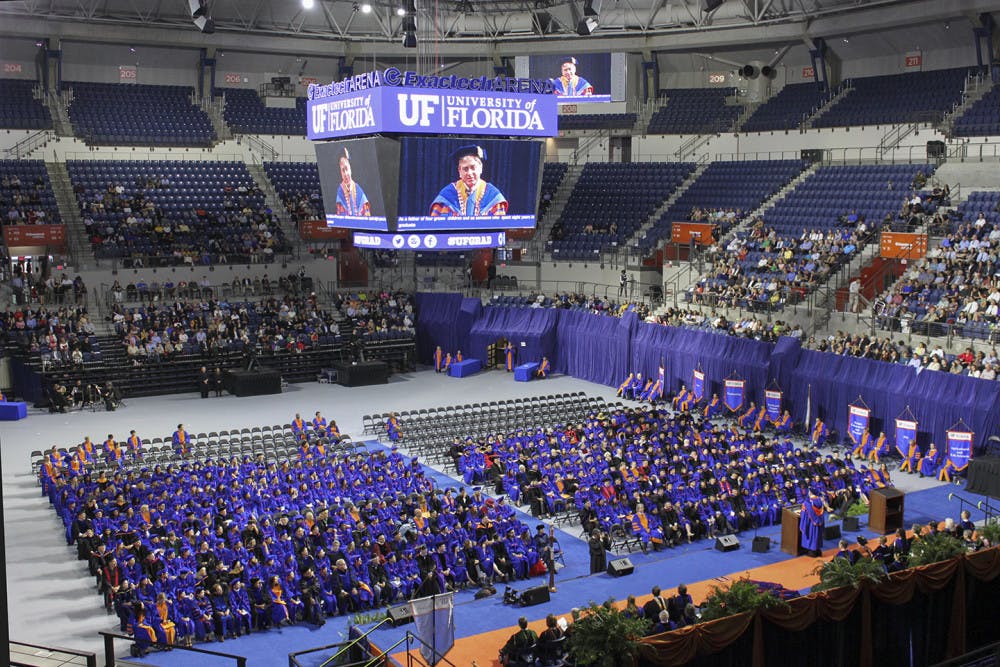 President Kent Fuchs appears on the JumboTron as he welcomes doctoral graduates, families and friends to the Fall Commencement ceremony in the newly renovated Stephen C. O’Connell Center on Friday, December 16, 2016. Friday’s ceremony was the first since the building’s renovation.