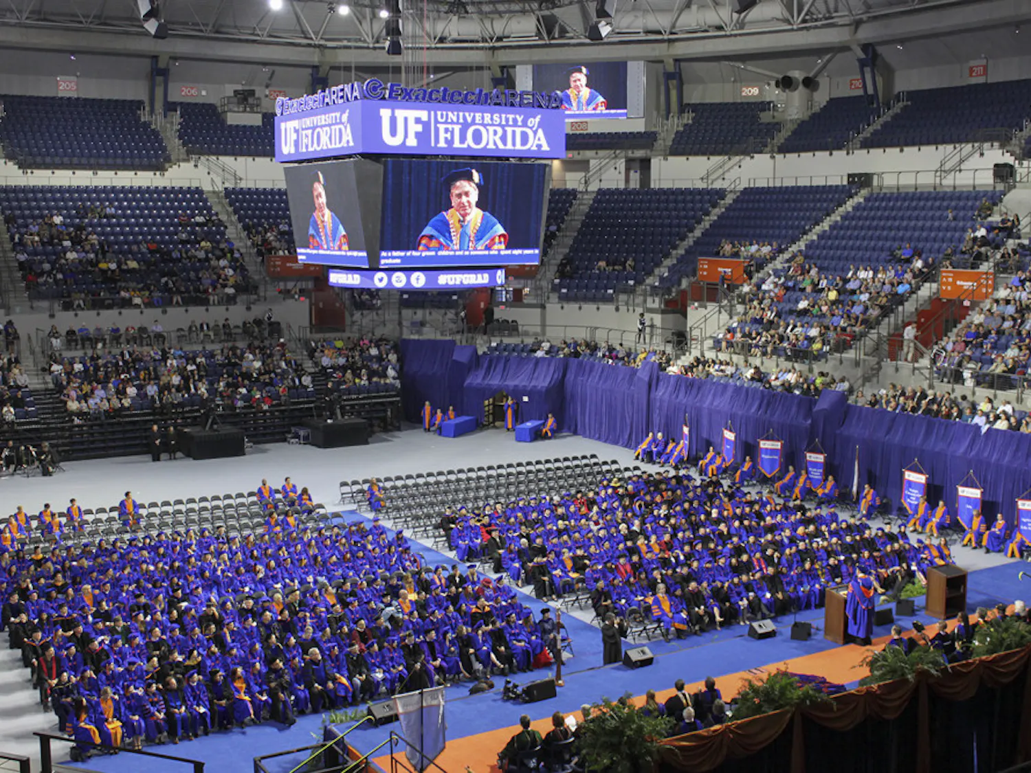 President Kent Fuchs appears on the JumboTron as he welcomes doctoral graduates, families and friends to the Fall Commencement ceremony in the newly renovated Stephen C. O’Connell Center on Friday, December 16, 2016. Friday’s ceremony was the first since the building’s renovation.