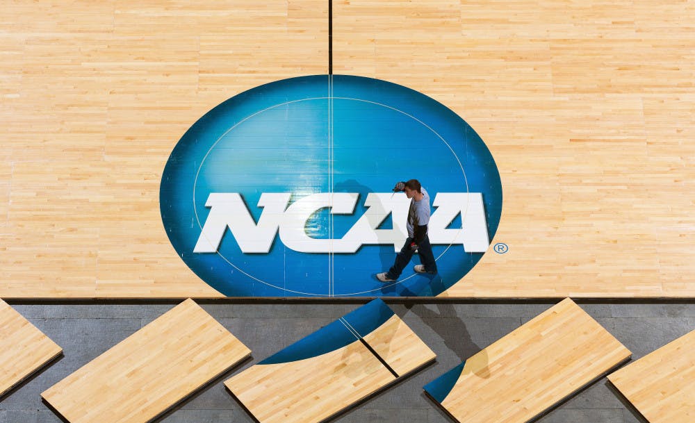 <p>Workers place the basketball court on the floor at the CenturyLink Center in Omaha, Neb., Tuesday March 17, 2015. The second and third rounds of the NCAA Men's Basketball Tournament will take place this weekend. Tuesday March 17, 2015. The second and third rounds of the NCAA Men's Basketball Tournament will take place this weekend. (AP Photo/The World-Herald, Matt Miller ) </p>