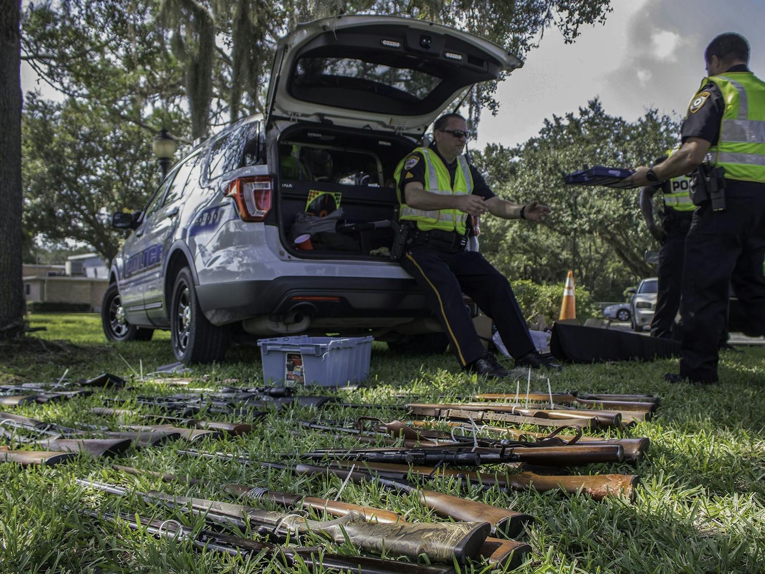 Gainesville Police Department collected 134 unwanted guns Saturday during a gun buyback held in front of Fire Station #3, 900 NE Waldo Road. The event, which was held in collaboration with the Alachua County Christian Pastors Association, was designed to reduce the number of weapons that could potentially fall into the wrong hands. Officers offered gift cards with amounts ranging from $50 to $300 or the option to take an Xbox One in exchange for a weapon. In total, the police had $5,000 plus the Xboxes to trade for guns. Darry Lloyd, spokesperson for the State Attorney’s Office, said the money for the buyback came from forfeiture funds, money confiscated in connection to illegal activity. All weapons turned over to officers are set to be broken down and destroyed unless someone has reported the gun stolen.