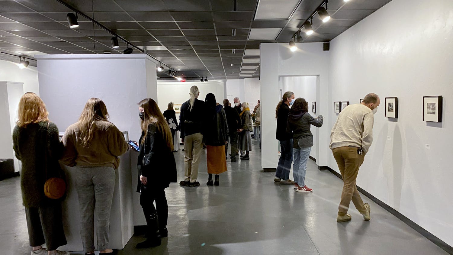 Attendees browse Gainesville artist Steven Bradbury’s art at the Santa Fe Art Gallery opening on Friday, Jan. 21.
