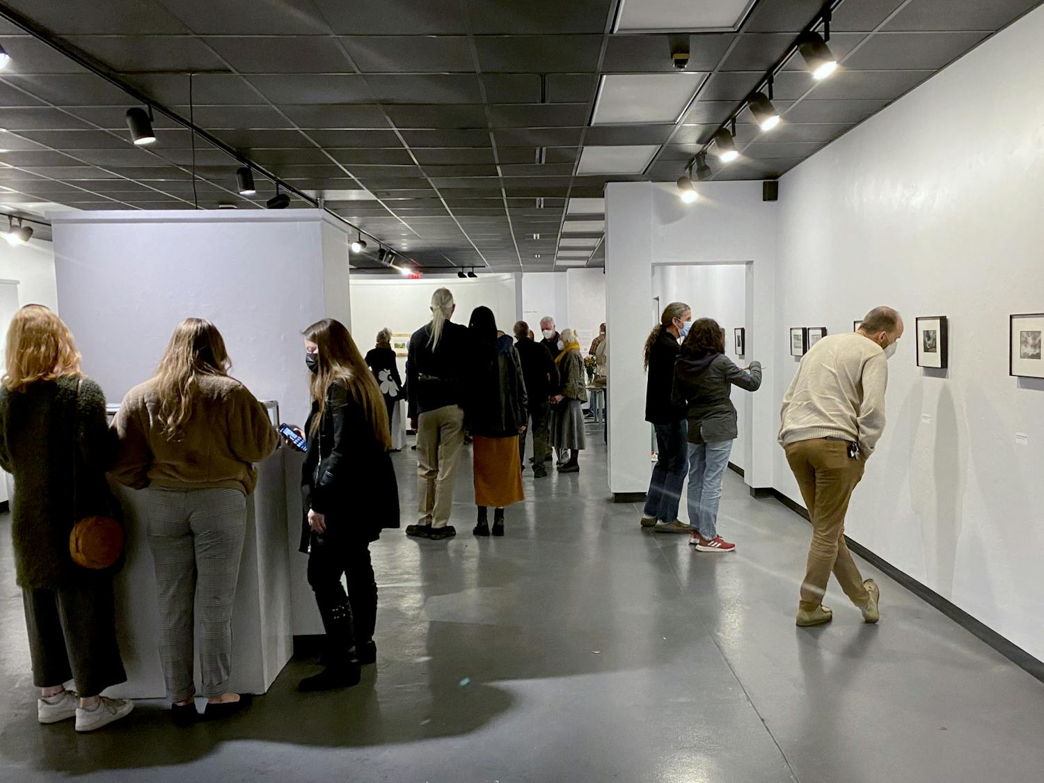 Attendees browse Gainesville artist Steven Bradbury’s art at the Santa Fe Art Gallery opening on Friday, Jan. 21.