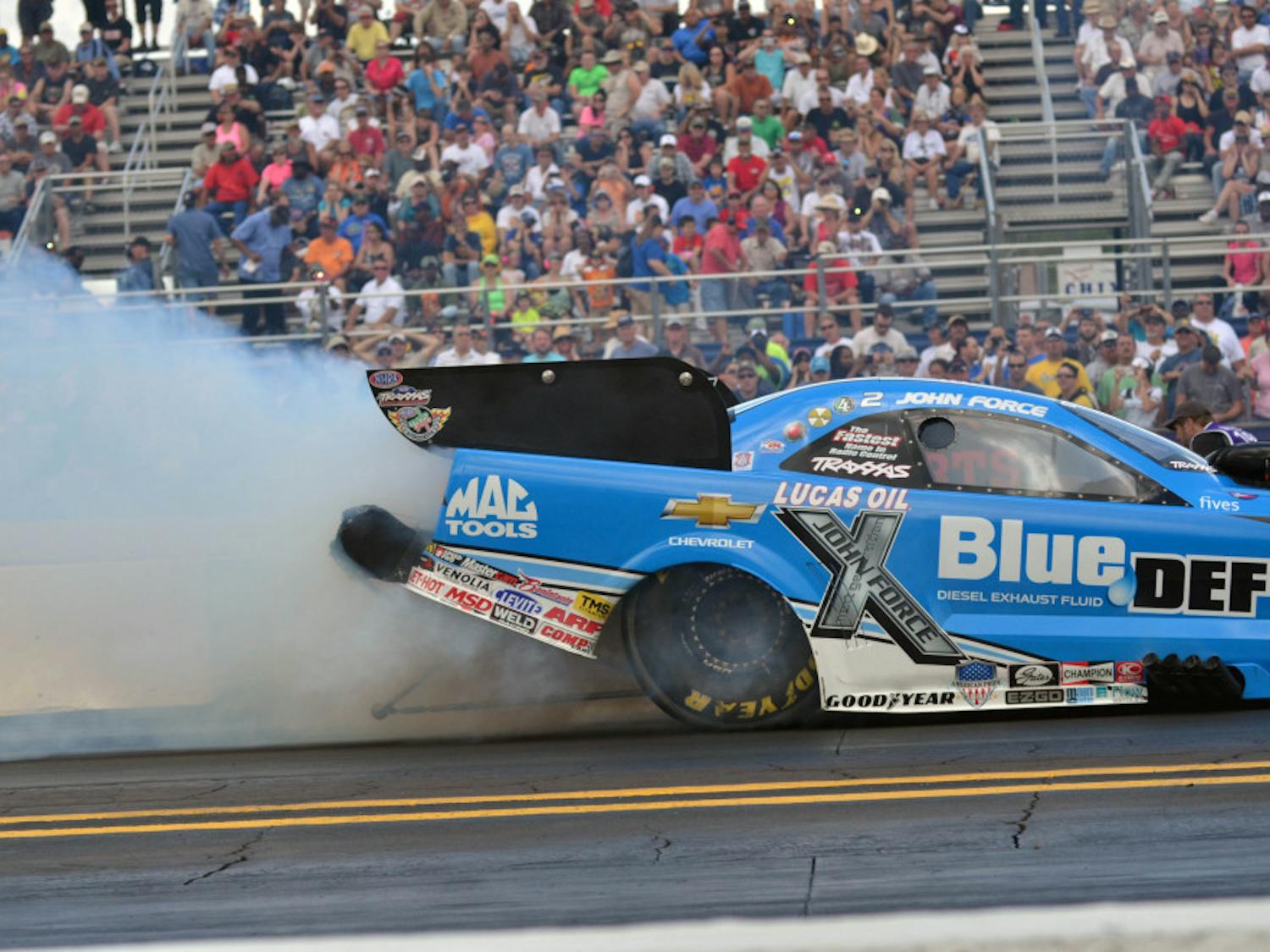 John Force races down the quarter-mile track at the Auto Plus Raceway in Gainesville during the 2015 Gatornationals on Saturday.