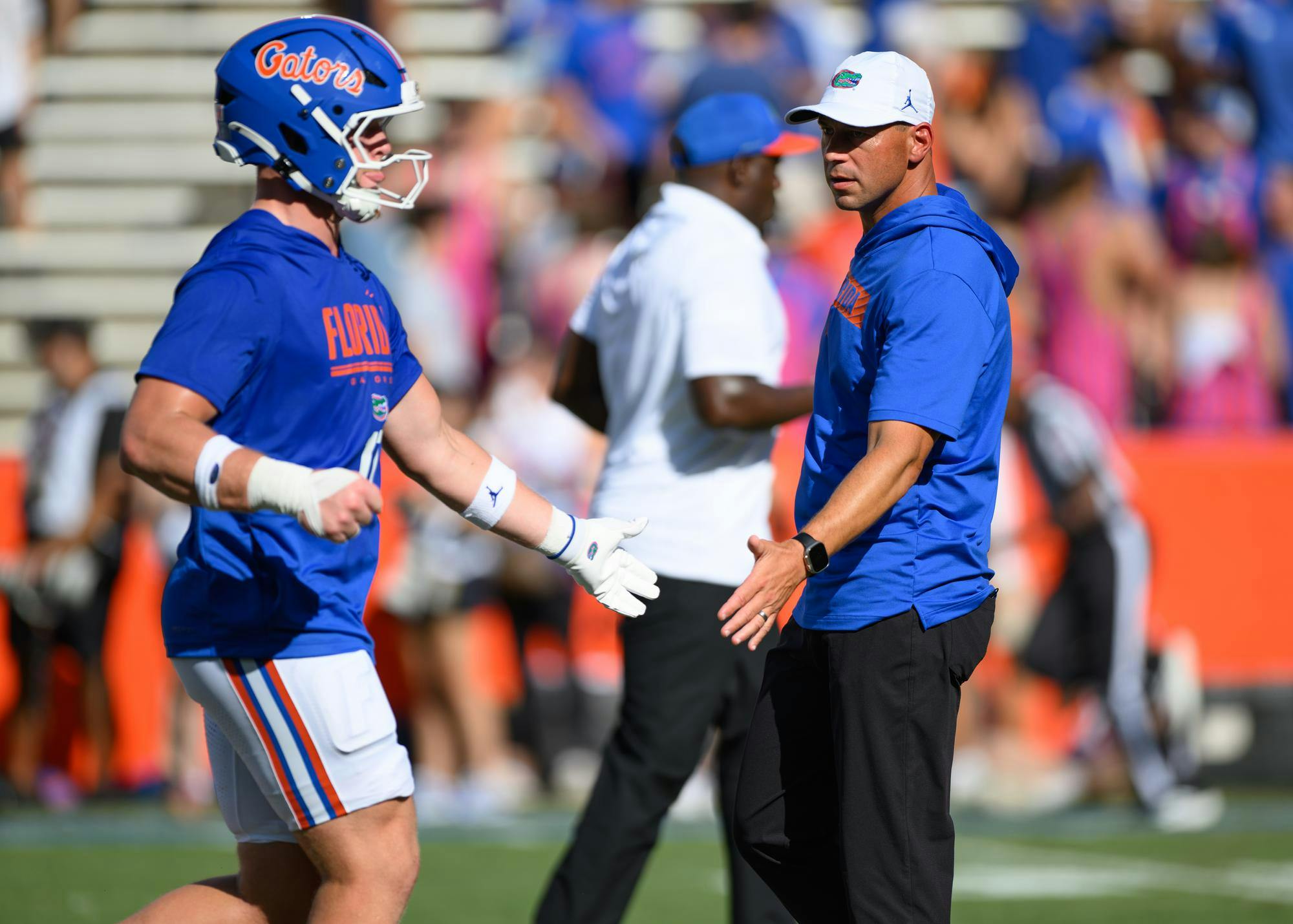 Florida head coach Jon Sumrall high fives a player before an NCAA college football game against Campbell, Saturday, Sept. 12, 2026, in Gainesville, Fla.