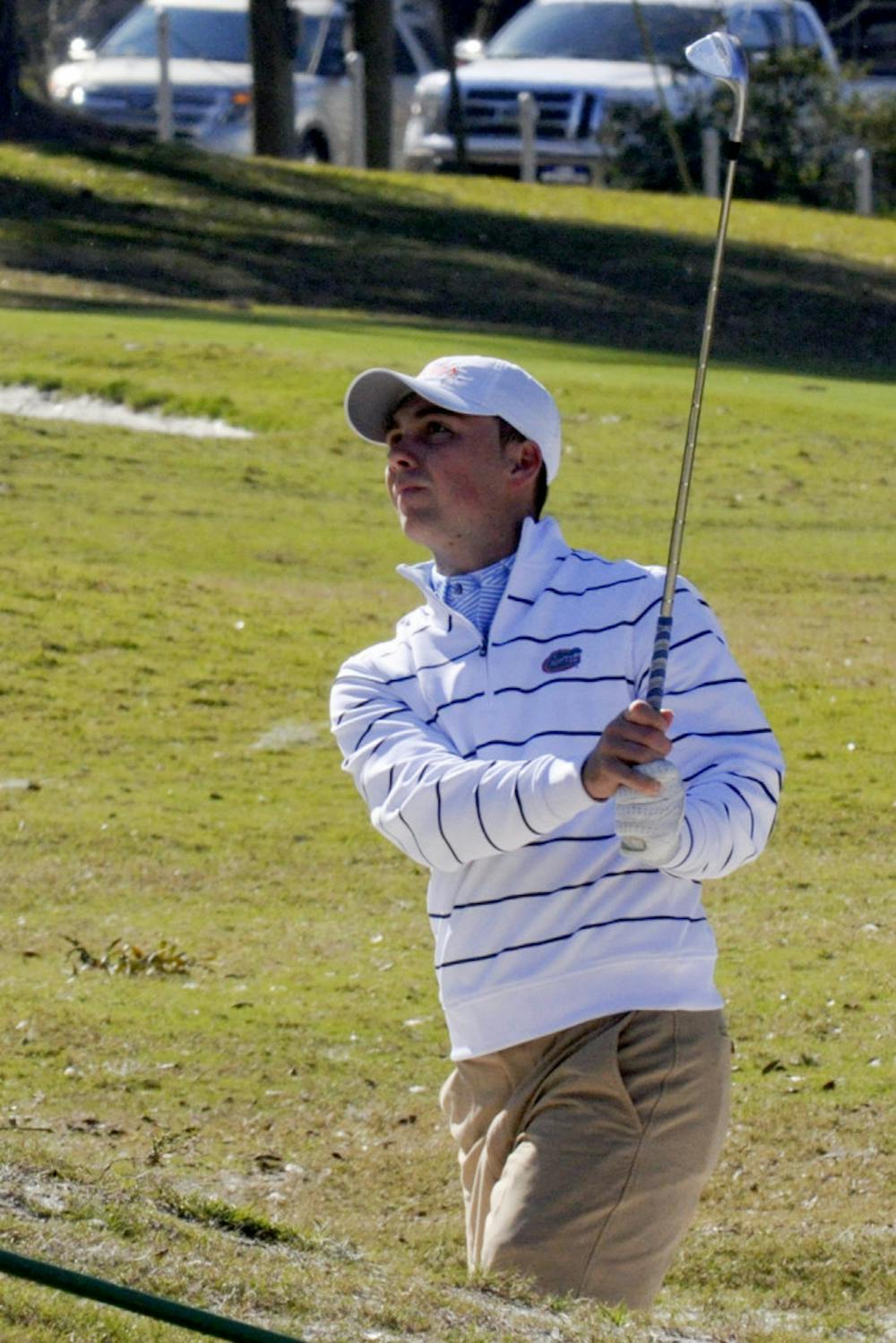 <p>J.D. Tomlinson swings during Day 1 of the SunTrust Gator Invitational on Feb. 14 at the Mark Bostick Golf Course.</p>