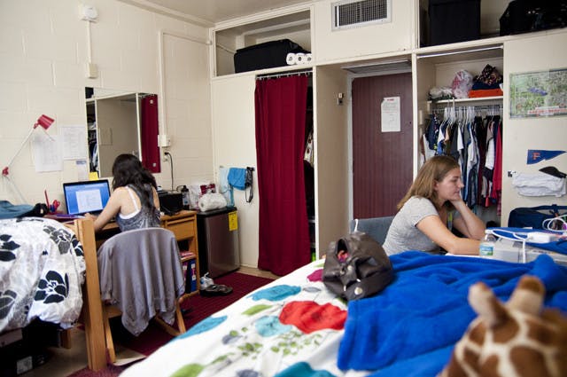 Freshmen Feriha Bilgen, biology major, and Alyssa Sicard, art major, study in their dorm room after their classes on the second day of the Fall 2011 semester.