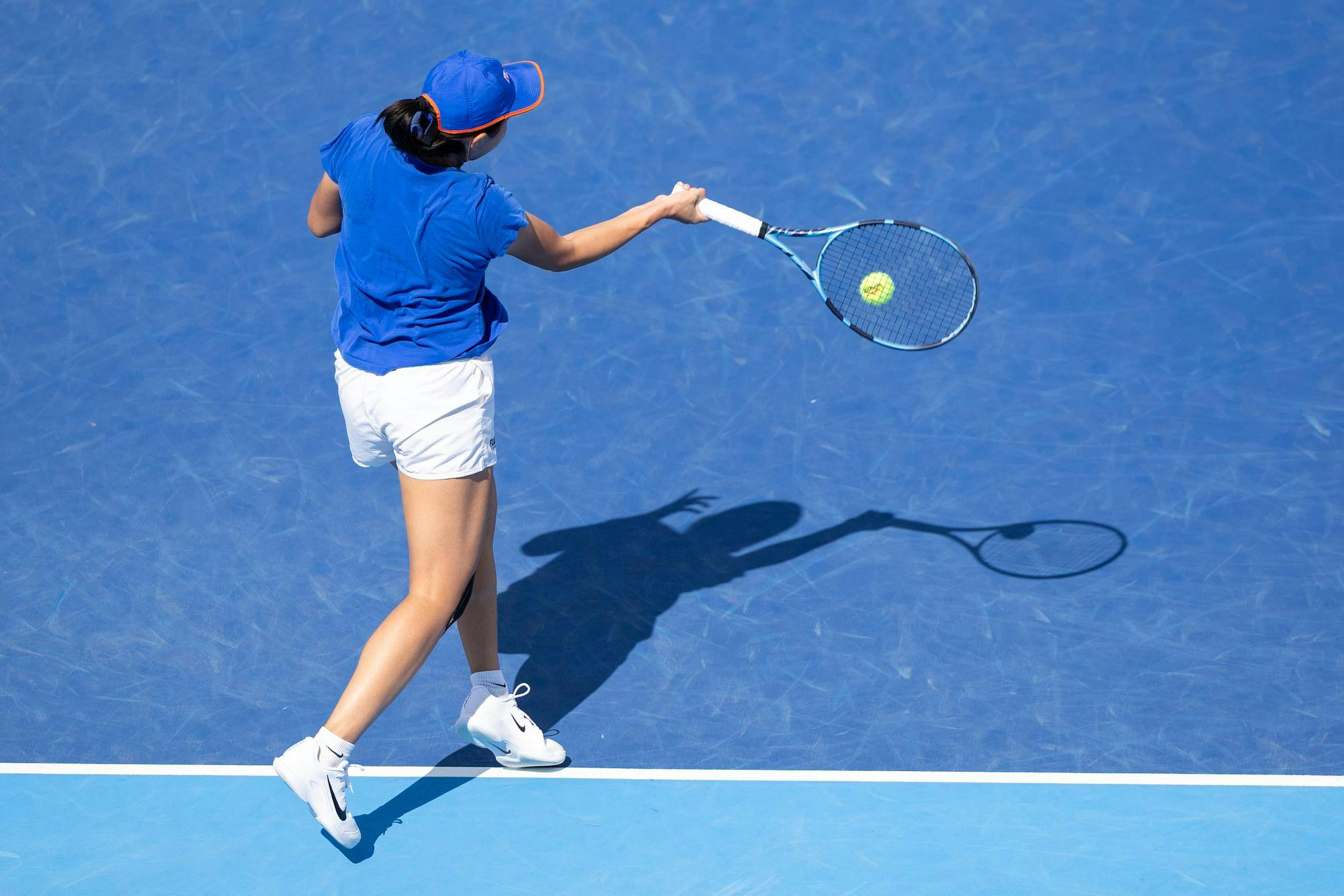 Xinyi Nong hits the ball during an NCAA tennis match, Thursday, Feb. 21, 2026.
