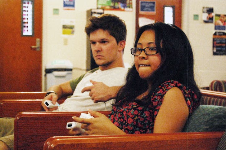 UF biology junior Julie Tran, 20, concentrates on defeating political science senior Dustin Morris, 21, in a game of Super Smash Bros. Brawl in the Lakeside Complex commons Wednesday evening.