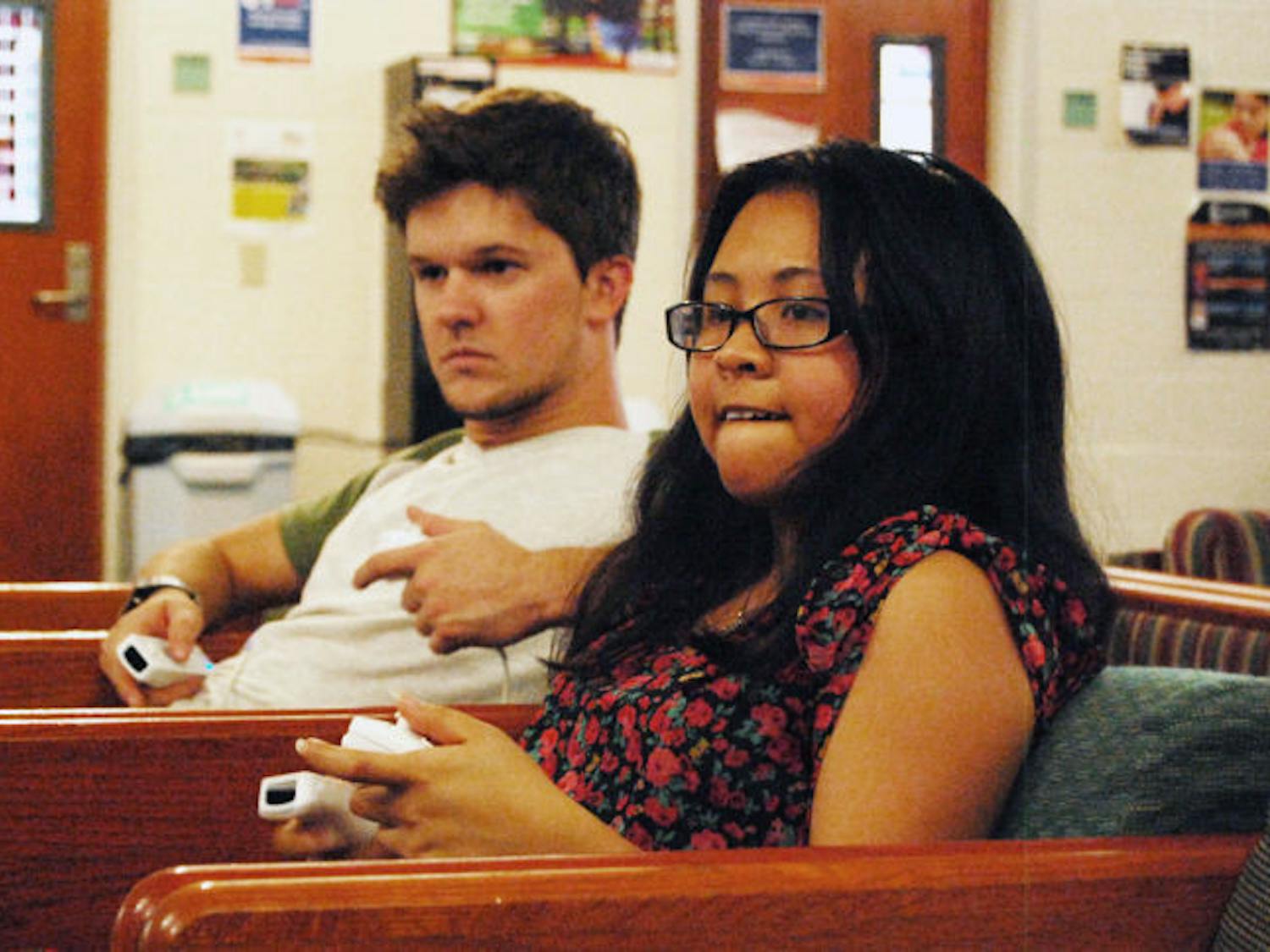 UF biology junior Julie Tran, 20, concentrates on defeating political science senior Dustin Morris, 21, in a game of Super Smash Bros. Brawl in the Lakeside Complex commons Wednesday evening.