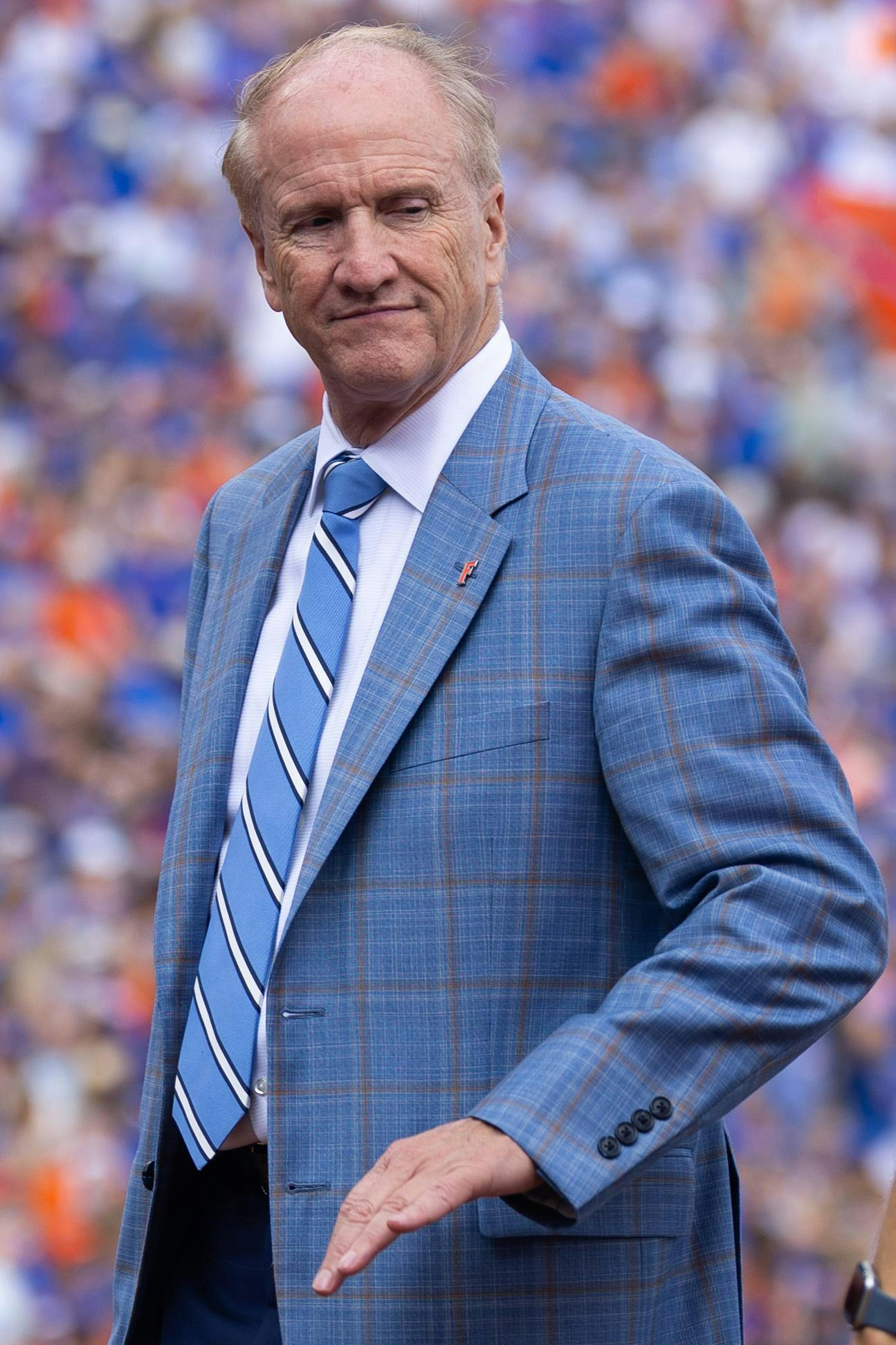 UF president Stuart Bell stands on the field during the first half of an NCAA college football game against South Carolina, Saturday, Oct. 10, 2026, in Gainesville, Fla.
