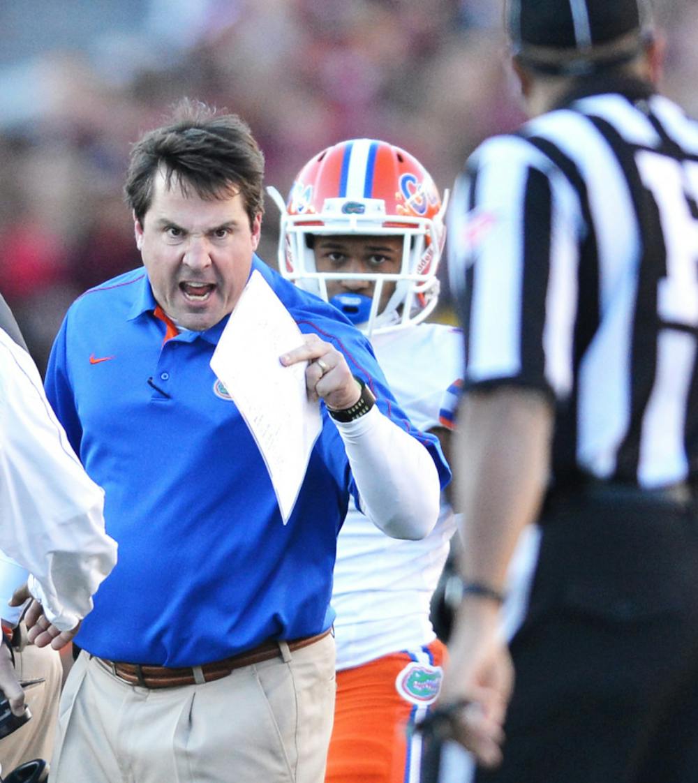 <p>Coach Will Muschamp exchanges words with an official during Florida’s 37-26 win against Florida State on Saturday at Doak Campbell Stadium in Tallahassee.</p>
