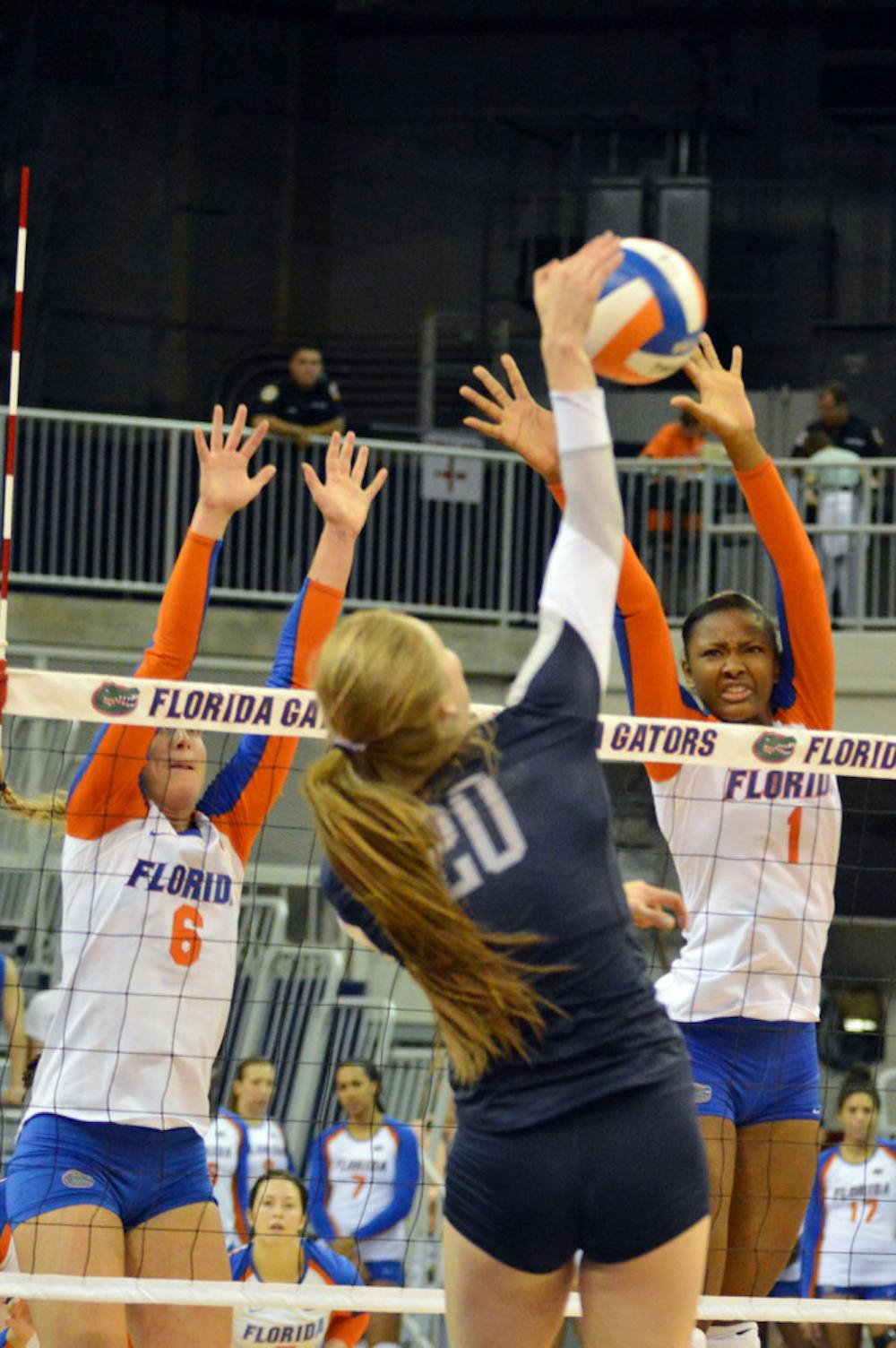 <p>Rhamat Alhassan (1) attempts a block during Florida's 3-0 win against Ole Miss on Sunday in the O'Connell Center.</p>