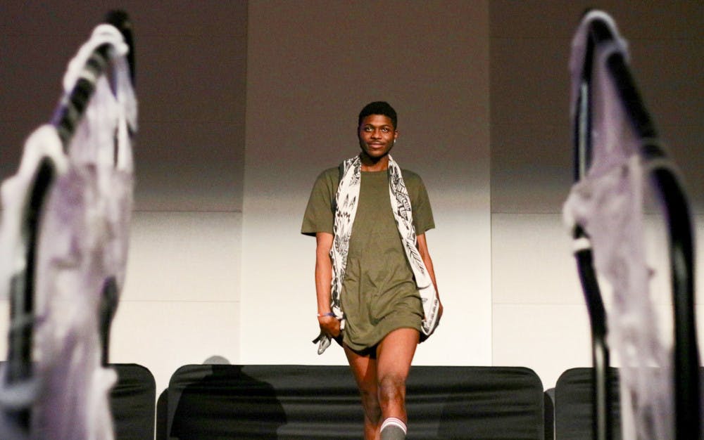 Modeling a Kardashian-inspired outfit, Triston Jefferson, a 20-year-old business administration junior, struts onstage in the Reitz Union Rion Ballroom during PSU’s Drag Ball on Tuesday night.