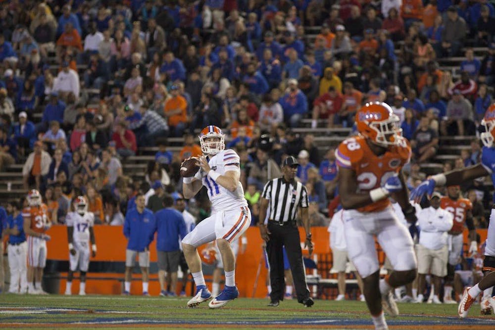 <p>UF quarterback Kyle Trask drops back to pass during Florida's Spring game on April 7, 2017, at Ben Hill Griffin Stadium.</p>