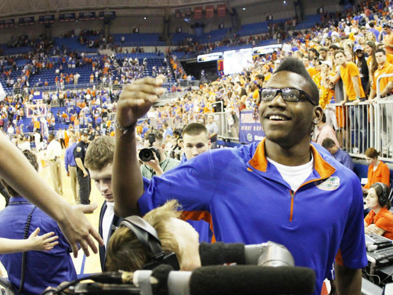 Junior forward Will Yeguete talks with fans following Florida’s 69-52 win against Kentucky on Feb. 12 in the O’Connell Center. Yeguete has been medically cleared to play against Alabama on Saturday at noon.
