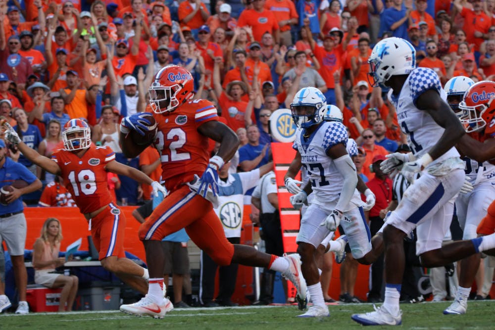 <p>Lamical Perine (22) runs toward the endzone during Florida's 45-7 win over Kentucky on Sept. 10, 2016, at Ben Hill Griffin Stadium.</p>