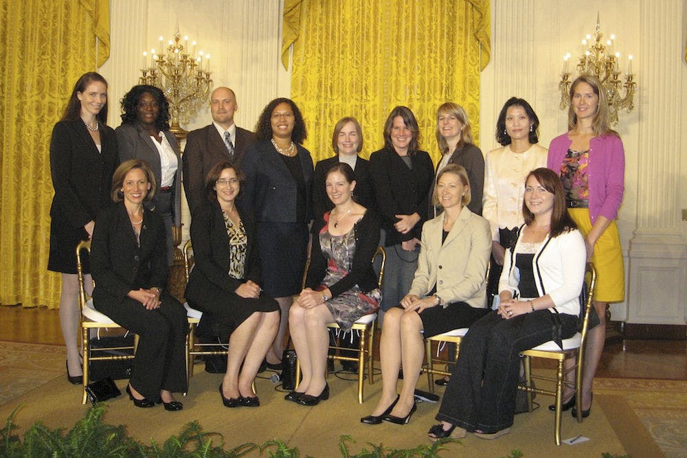 <p>Michele Manuel (fourth from the left, back row), an assistant UF professor in the materials science and engineering department, poses for a photo in the White House. Manuel was one of 106 researchers who were honored by the Presidential Early Career Award for Scientists and Engineers last weekend.</p>