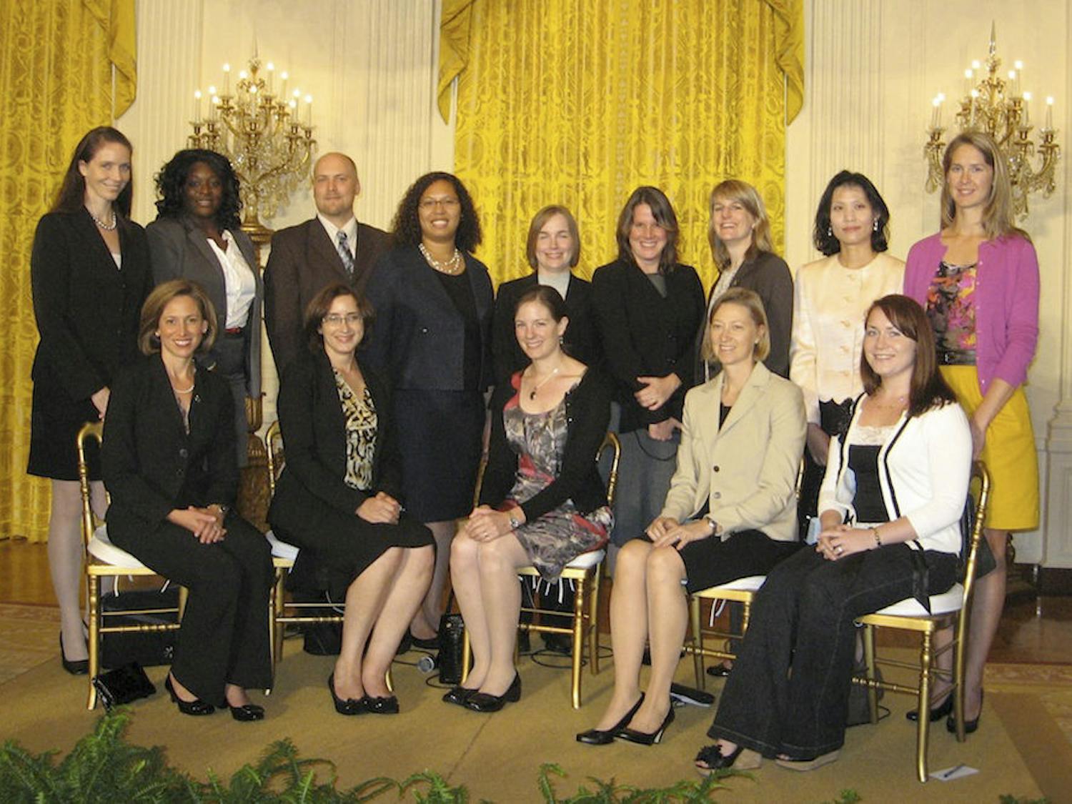 Michele Manuel (fourth from the left, back row), an assistant UF professor in the materials science and engineering department, poses for a photo in the White House. Manuel was one of 106 researchers who were honored by the Presidential Early Career Award for Scientists and Engineers last weekend.