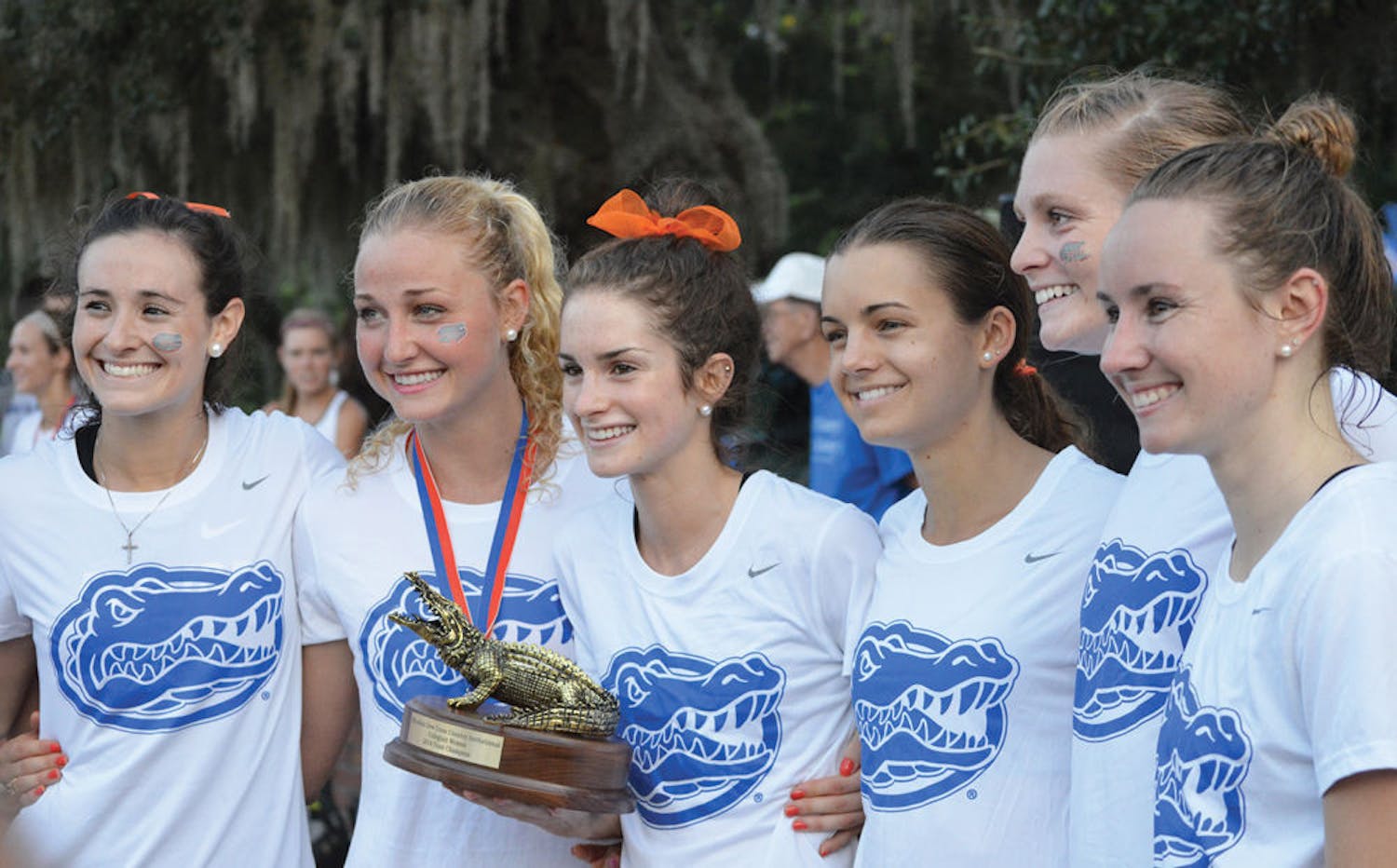 The Florida women's cross country team accepts its first-place trophy at the 2014 Mountain Dew Invitational