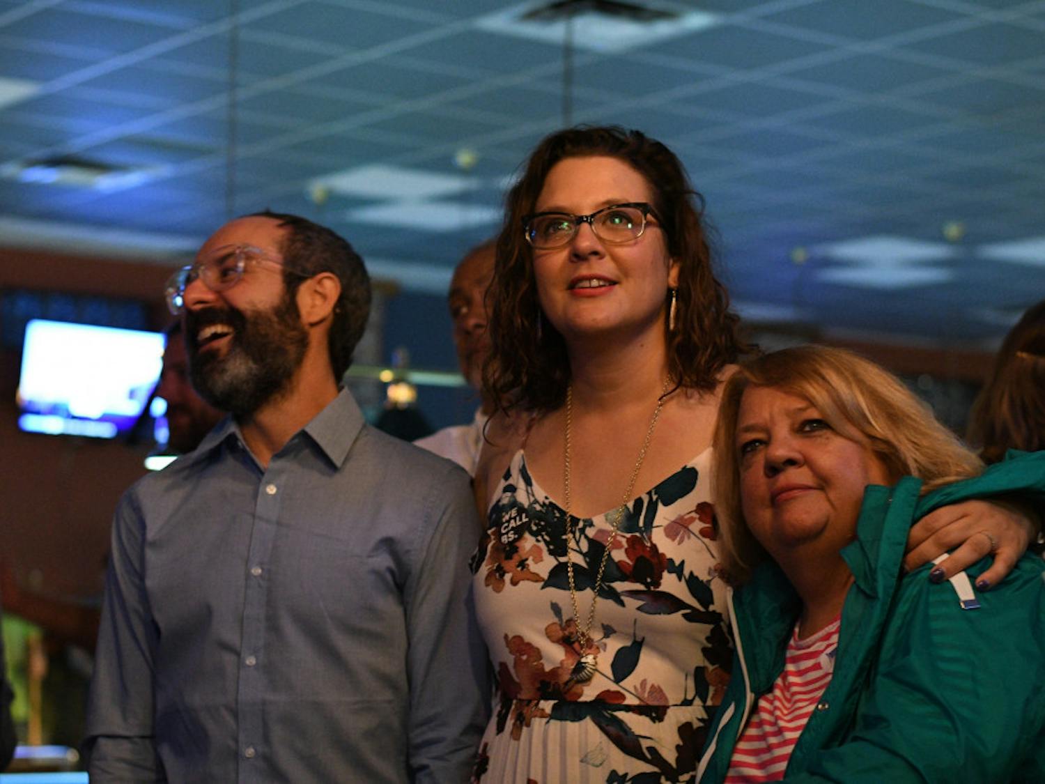 State Senate candidate and Gainesville Democrat Olysha Magruder anxiously awaits election results with her husband James McRae and mother Karen Magruder at the Palomino Pool Hall on Tuesday night. Magruder lost the election.