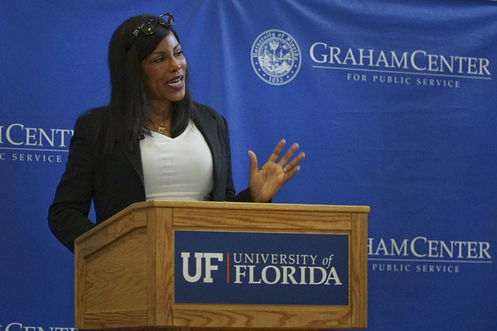 <p>Ilyasah Shabazz, daughter of Malcom X, speaks to students at the Bob Graham Center Monday. She talked about producing changes in global issues, such as institutionalized racism, through education.</p>