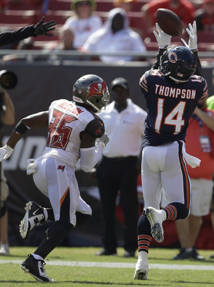 Chicago Bears wide receiver Deonte Thompson (14) catches a touchdown pass ahead of Tampa Bay Buccaneers defensive back Robert McClain (36), during the second half of an NFL football game, Sunday, Sept. 17, 2017, in Tampa, Fla. The Bucs defeated the Bears 29-7. (AP Photo/Chris O'Meara)