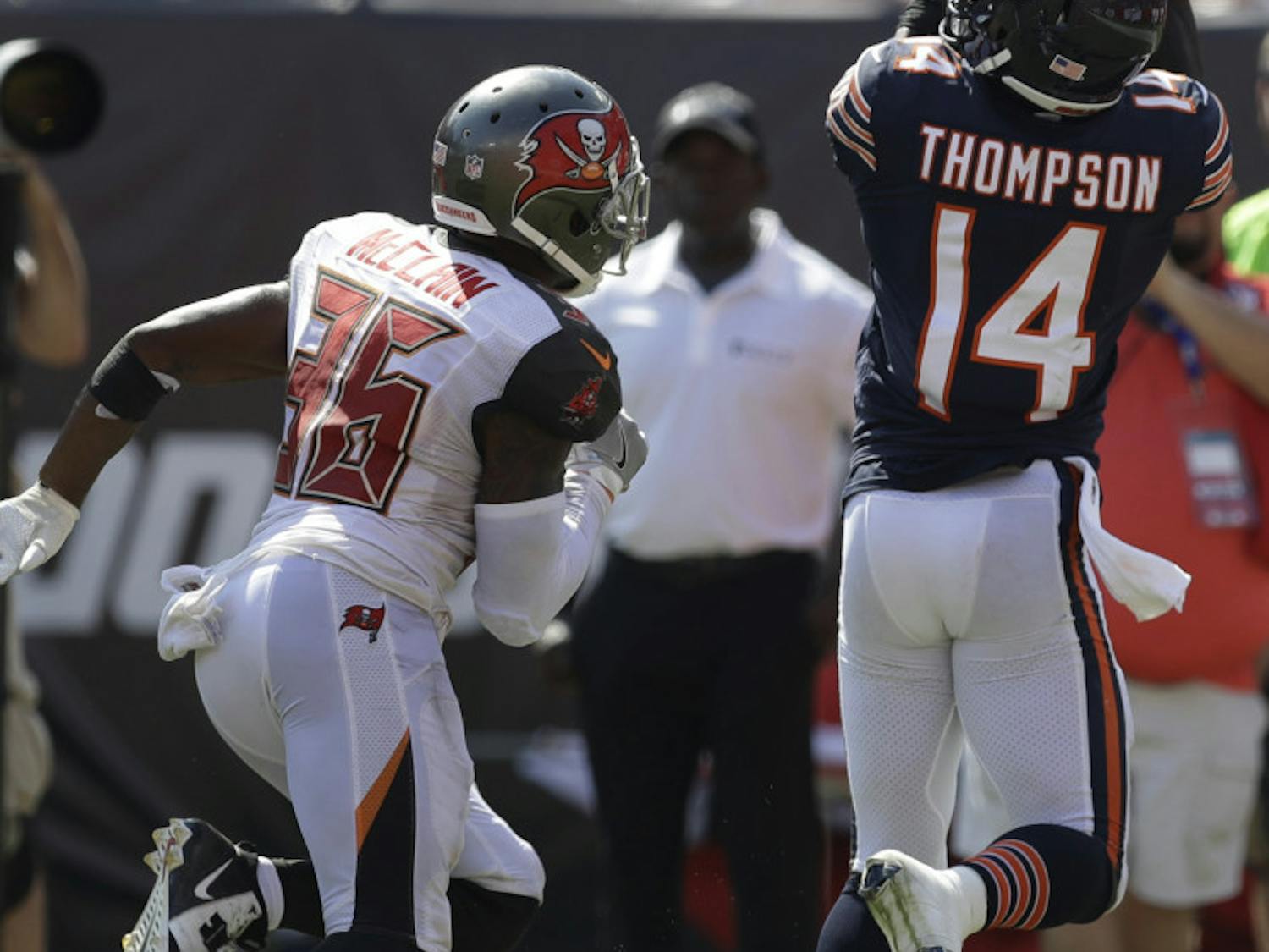 Chicago Bears wide receiver Deonte Thompson (14) catches a touchdown pass ahead of Tampa Bay Buccaneers defensive back Robert McClain (36), during the second half of an NFL football game, Sunday, Sept. 17, 2017, in Tampa, Fla. The Bucs defeated the Bears 29-7. (AP Photo/Chris O'Meara)