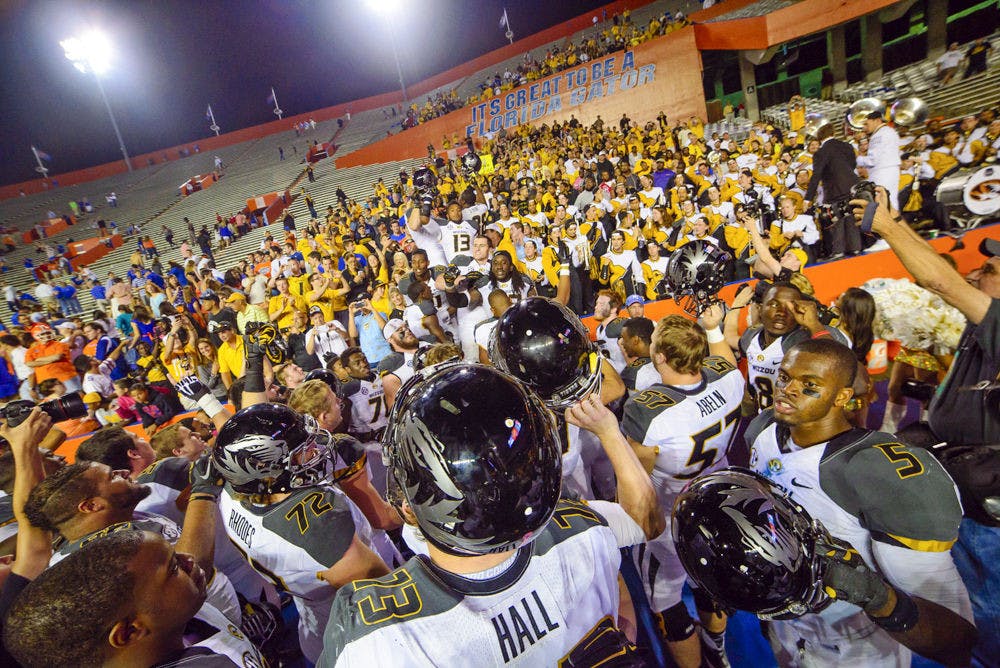 <p>Missouri players celebrate after their 42-13 win against Florida on Oct. 18, 2014, at Ben Hill Griffin Stadium.</p>