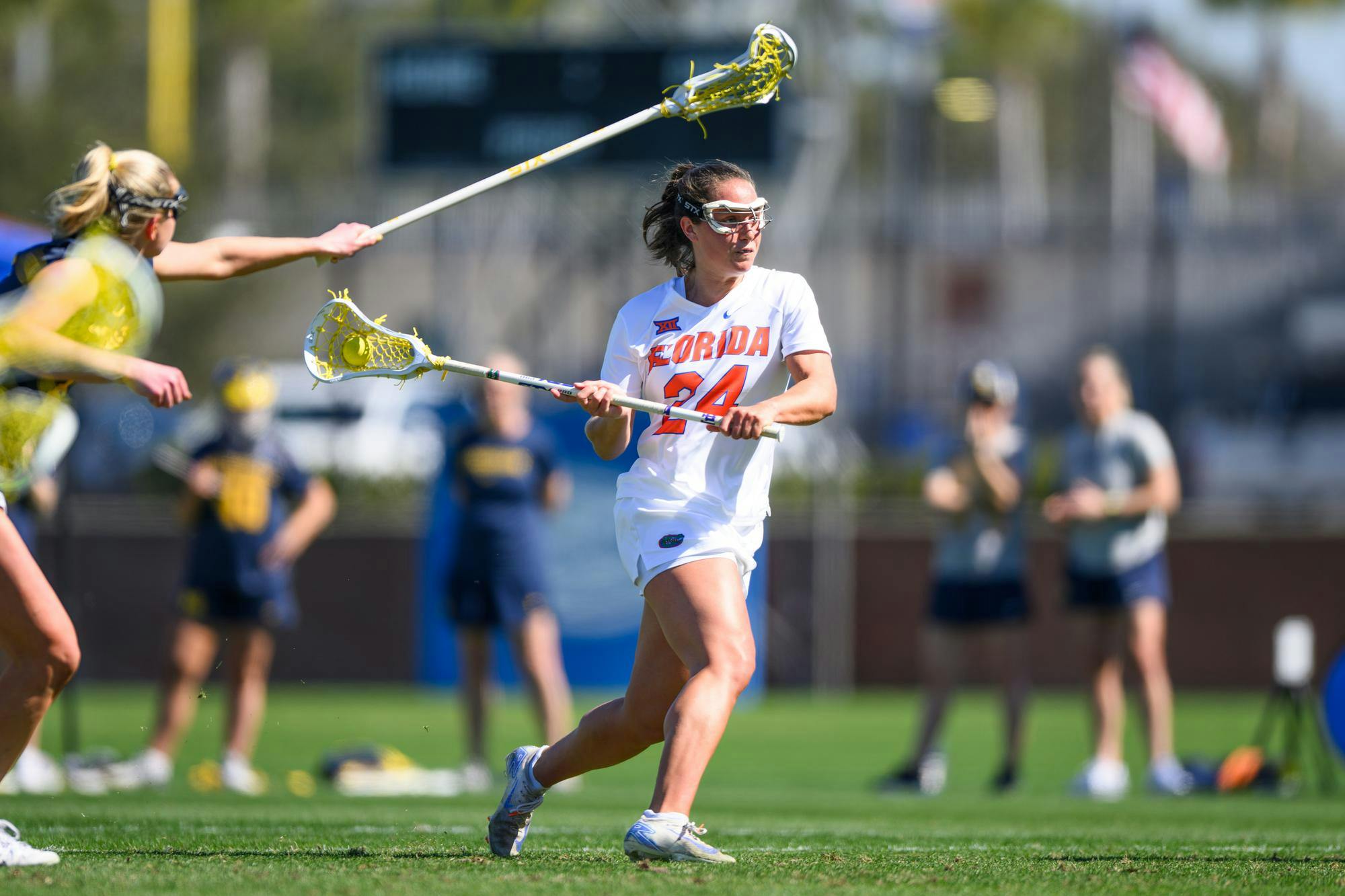 Florida midfielder Gabbi Koury (24) shoots during the first half of an NCAA lacrosse match against Michigan, Friday, Feb. 13, 2026, in Gainesville, Fla.