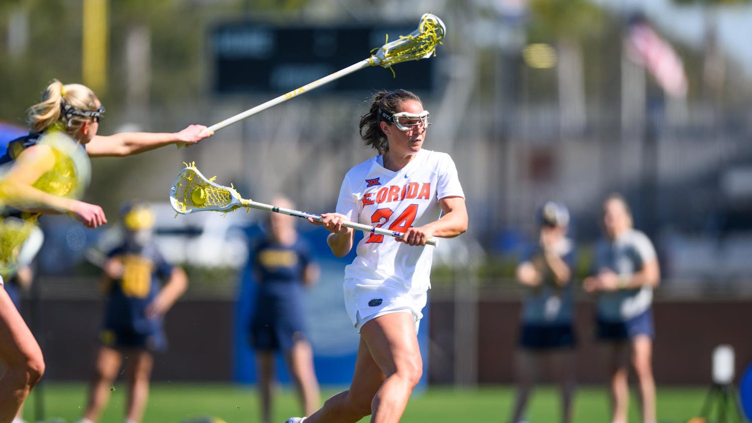 Florida midfielder Gabbi Koury (24) shoots during the first half of an NCAA lacrosse match against Michigan, Friday, Feb. 13, 2026, in Gainesville, Fla.