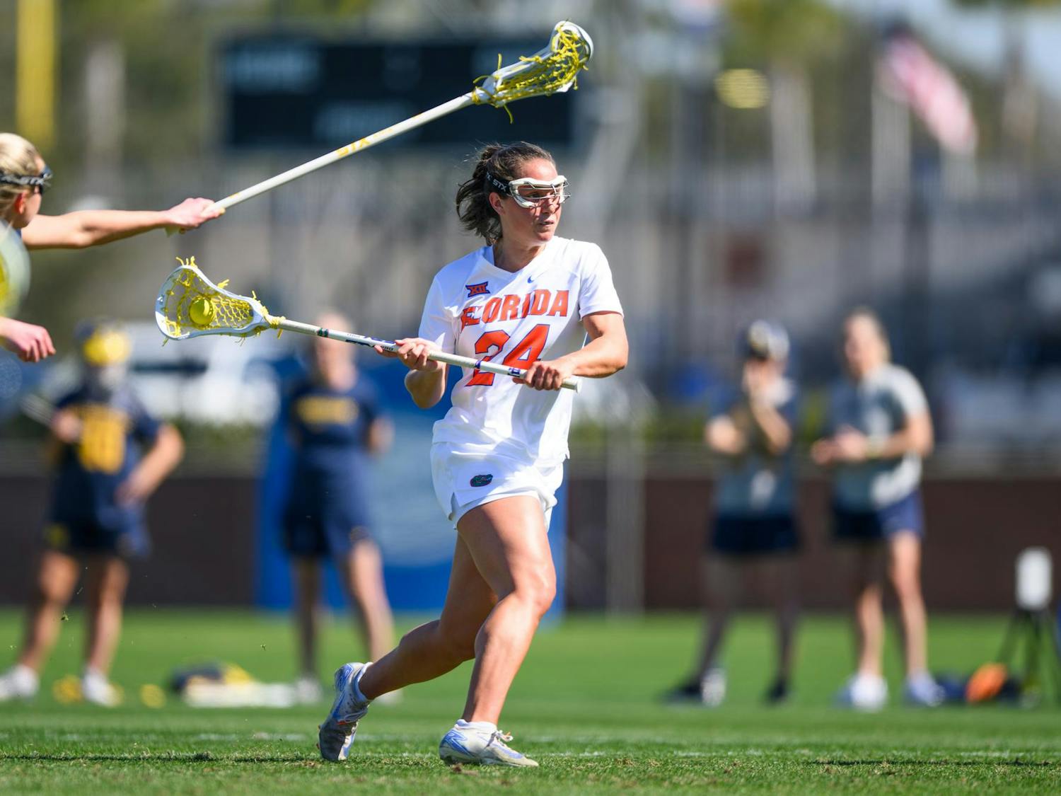 Florida midfielder Gabbi Koury (24) shoots during the first half of an NCAA lacrosse match against Michigan, Friday, Feb. 13, 2026, in Gainesville, Fla.