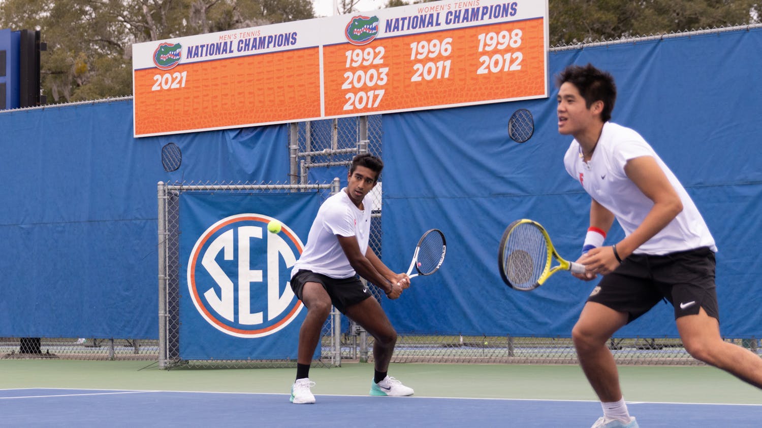 Florida freshman Adhithya Ganesan (left) rips a backhand with sophomore Tanapatt Nirundorn (right) in the Gators’ 7-0 win against The Citadel on Friday, Jan. 19, 2024.
