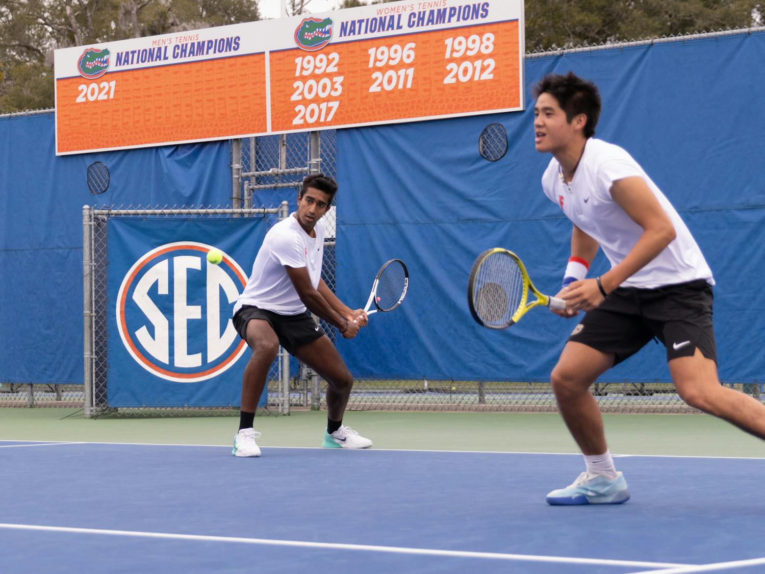 Florida freshman Adhithya Ganesan (left) rips a backhand with sophomore Tanapatt Nirundorn (right) in the Gators’ 7-0 win against The Citadel on Friday, Jan. 19, 2024.
