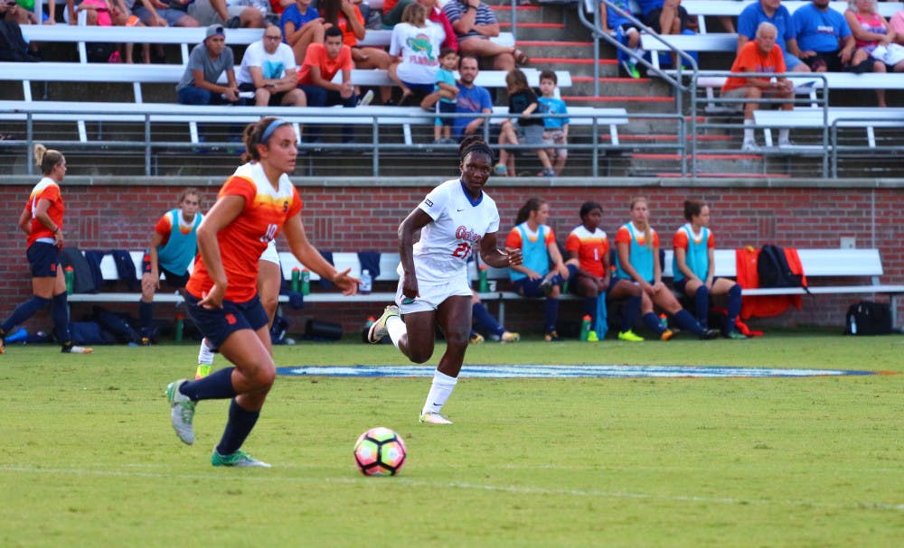 <p>Deanne Rose chases a Syracuse player with possession of the ball during Florida's 2-1 win against the Orange on Aug. 27 at Donald R. Dizney Stadium.</p>