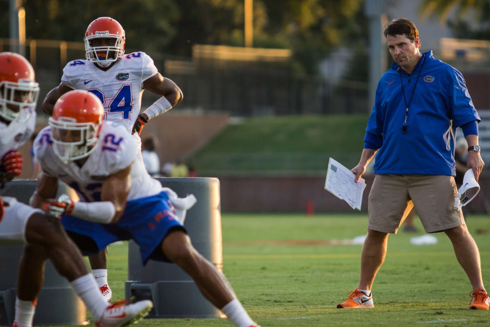 Will Muschamp looks on during practice on Aug. 9 at Donald R. Dizney Stadium. Muschamp, entering his fourth year as head coach, faces a tough schedule including road games against Alabama and Florida State.